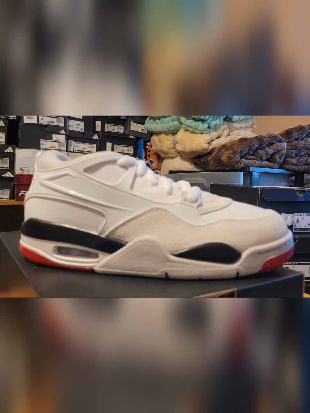 Air Jordans 4 RM  Sz 5.5Y White Athletic Sneakers with Black and Red Accents